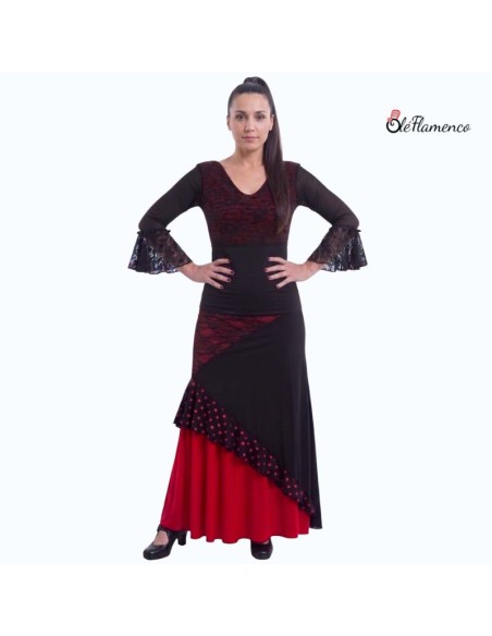 Conjunto de baile flamenco con cuerpo de encaje y falda asimétrica con volante de lunares y madroños.